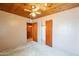 Bedroom features a ceiling fan, wood ceiling, and closet space at 3115 N 26Th St, Phoenix, AZ 85016
