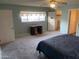 Spacious bedroom with carpet, ceiling fan, a desk, and access to a large walk-in closet at 3115 N 26Th St, Phoenix, AZ 85016