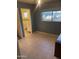 Bedroom with tile flooring and an attached bathroom, combining comfort and functionality for everyday living at 3115 N 26Th St, Phoenix, AZ 85016