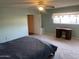 Spacious bedroom with carpet, ceiling fan, a desk, and access to a large walk-in closet at 3115 N 26Th St, Phoenix, AZ 85016