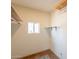 Walk-in closet with built-in shelving units and natural light from window for great organization at 3115 N 26Th St, Phoenix, AZ 85016
