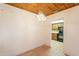 Dining area with wooden ceiling and chandelier opens to kitchen with appliances at 3115 N 26Th St, Phoenix, AZ 85016
