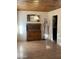 A clean dining room with wood floors and hutch, awaiting personalization to create a warm, inviting space at 3115 N 26Th St, Phoenix, AZ 85016