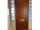 This features a solid wood front door framed by decorative glass block windows at 3115 N 26Th St, Phoenix, AZ 85016