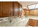 Kitchen features wooden cabinets, granite countertops, and stainless-steel appliances at 3115 N 26Th St, Phoenix, AZ 85016