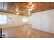 Bright living room with wood-look floors and a unique wood panel ceiling at 3115 N 26Th St, Phoenix, AZ 85016