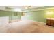 Bright living room featuring wet bar, lots of wall space, and an exit to the exterior at 3115 N 26Th St, Phoenix, AZ 85016