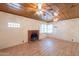 Living room featuring wood-look floors, a fireplace, and unique wood panel ceiling at 3115 N 26Th St, Phoenix, AZ 85016