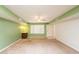 Bright living room with green walls, neutral carpet, and a ceiling fan offers a flexible layout at 3115 N 26Th St, Phoenix, AZ 85016
