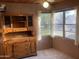 Sun-drenched room featuring a vintage hutch and multiple windows, offering a bright, inviting space at 3115 N 26Th St, Phoenix, AZ 85016