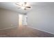 A bedroom featuring neutral walls, carpeted floor, and access to closet at 316 N 78Th Pl, Mesa, AZ 85207