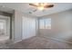 Bright bedroom with carpeted floors, closet, and views through the window at 316 N 78Th Pl, Mesa, AZ 85207