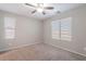 A simple carpeted bedroom with neutral walls and lots of natural light at 316 N 78Th Pl, Mesa, AZ 85207