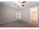A bedroom featuring neutral walls, carpeted floor, and access to closet at 316 N 78Th Pl, Mesa, AZ 85207