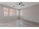 Light-filled bedroom offering wood-look tile flooring and a ceiling fan at 316 N 78Th Pl, Mesa, AZ 85207