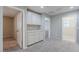 Versatile bonus room with built-in cabinets and carpeted flooring at 316 N 78Th Pl, Mesa, AZ 85207