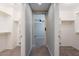 Walk-in closet featuring built-in shelving and rod for optimal organization at 316 N 78Th Pl, Mesa, AZ 85207