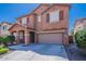 Beautiful home showing a spacious driveway, an attached two-car garage, and a covered front porch at 316 N 78Th Pl, Mesa, AZ 85207