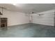 Spacious garage with a rolling door and plenty of room for storage at 316 N 78Th Pl, Mesa, AZ 85207