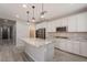 Well-equipped kitchen with stainless steel appliances, granite countertops, and a functional center island at 316 N 78Th Pl, Mesa, AZ 85207