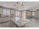 Large kitchen island featuring granite countertop and cabinets, ideal for cooking and entertaining at 316 N 78Th Pl, Mesa, AZ 85207