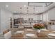 Modern kitchen features stainless steel appliances, a large island, and stylish pendant lighting at 316 N 78Th Pl, Mesa, AZ 85207