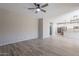 Spacious living room showcases an open floor plan and elegant wood-look tile flooring at 316 N 78Th Pl, Mesa, AZ 85207