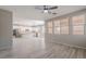 Open-concept living room featuring modern wood-look tile flooring and natural light at 316 N 78Th Pl, Mesa, AZ 85207
