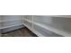 Spacious pantry with wooden shelves, offering ample storage space at 316 N 78Th Pl, Mesa, AZ 85207