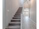 Carpeted staircase with white railing, leading to the upper level of the home at 316 N 78Th Pl, Mesa, AZ 85207