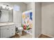 Bathroom featuring white vanity, toilet, and colorful shower curtain at 32819 N 23Rd Ave, Phoenix, AZ 85085