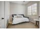 Cozy bedroom featuring neutral decor, a comfortable daybed, and a bright window, creating a relaxing space at 32819 N 23Rd Ave, Phoenix, AZ 85085