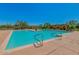 Large community pool with lounge seating offers relaxation and recreation for residents at 32819 N 23Rd Ave, Phoenix, AZ 85085