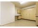 Finished garage with ample storage cabinets and workspace at 32819 N 23Rd Ave, Phoenix, AZ 85085