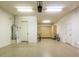 Spacious garage with water heater, storage cabinets, and epoxy flooring at 32819 N 23Rd Ave, Phoenix, AZ 85085