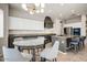 Open-concept kitchen featuring a large island, granite countertops, and stainless steel appliances at 32819 N 23Rd Ave, Phoenix, AZ 85085