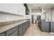Stylish kitchen with gray cabinets, granite countertops, and modern appliances at 32819 N 23Rd Ave, Phoenix, AZ 85085
