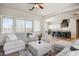 Comfortable living room featuring plush seating and an open view into the kitchen at 32819 N 23Rd Ave, Phoenix, AZ 85085
