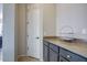 Butler's pantry with granite countertops and shaker style cabinets at 32819 N 23Rd Ave, Phoenix, AZ 85085