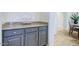 Butler's pantry features granite countertops and shaker style cabinets at 32819 N 23Rd Ave, Phoenix, AZ 85085