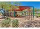 Community playground with swings, slides, and shade structure provides outdoor fun at 32819 N 23Rd Ave, Phoenix, AZ 85085