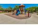 Community playground with multiple slides and climbing structures surrounded by lush greenery at 32819 N 23Rd Ave, Phoenix, AZ 85085