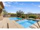 Refreshing pool and spa with stainless steel handrail and desert landscape backdrop at 32819 N 23Rd Ave, Phoenix, AZ 85085