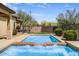 Inviting backyard pool and patio area offers a refreshing outdoor retreat at 32819 N 23Rd Ave, Phoenix, AZ 85085