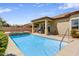 Inviting pool and spa with convenient access to home's covered outdoor seating area at 32819 N 23Rd Ave, Phoenix, AZ 85085