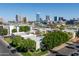 Aerial view showcases the complex with lush trees in a cityscape at 3655 N 5Th Ave # 202, Phoenix, AZ 85013