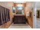 Stylish bathroom vanity with granite counters and a decorative mirror at 3655 N 5Th Ave # 202, Phoenix, AZ 85013