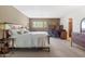 Bright bedroom with a desk area, neutral walls, and plush carpet flooring at 3655 N 5Th Ave # 202, Phoenix, AZ 85013