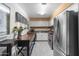 A bright kitchen with stainless steel refrigerator, white cabinets, and a moveable island offers ample cooking space at 3655 N 5Th Ave # 202, Phoenix, AZ 85013
