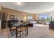 A roomy living room and dining space with large windows, comfortable seating, and neutral walls offers easy living at 3655 N 5Th Ave # 202, Phoenix, AZ 85013